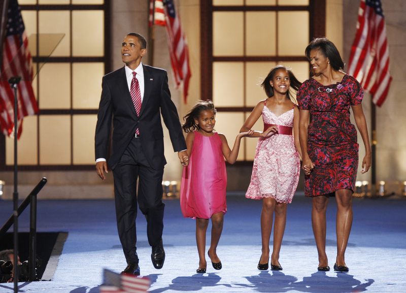 Democratic presidential nominee U.S. Senator Barack Obama  walks with his daughter Sasha, daughter Malia, and wife Michelle after his speech at the 2008 Democratic National Convention in Denver
