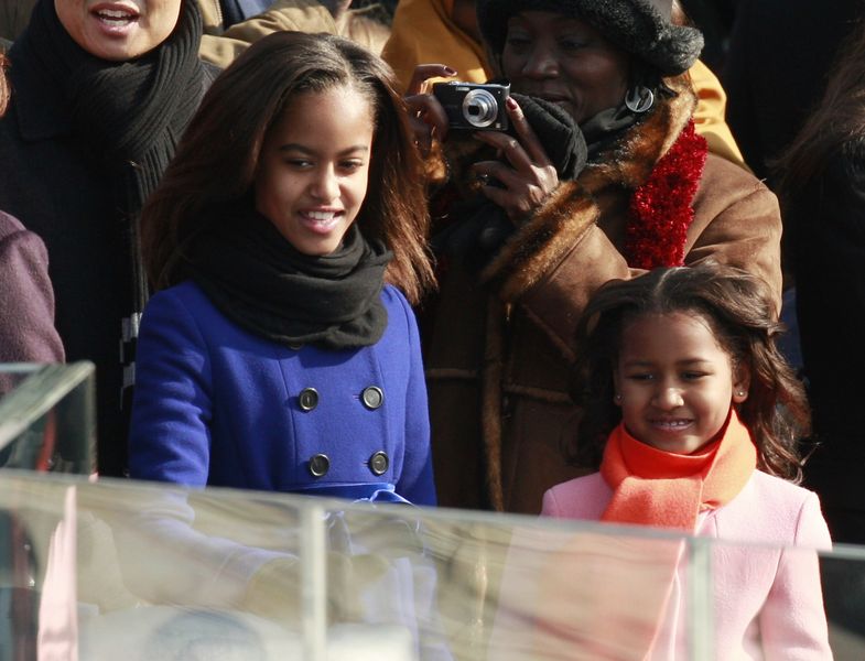 Malia and Sasha Obama arrive at the inauguration ceremony of their father in Washington