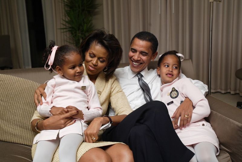 Illinois US Senate candidate Democrat Barack Obama with his family in their Chicago hotel room