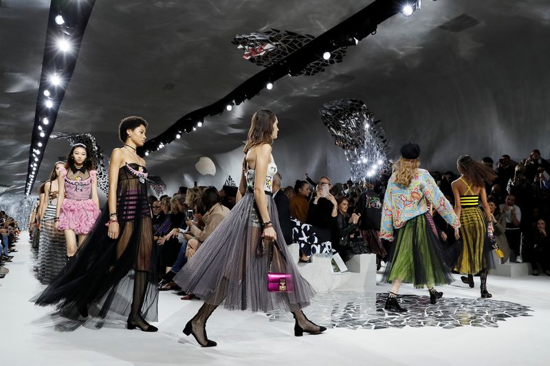 Models present creations by Italian designer Maria Grazia Chiuri as part of her Spring/Summer 2018 women’s ready-to-wear collection show for fashion house Dior during Paris Fashion Week