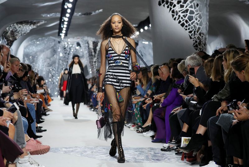 A model presents a creation by Italian designer Maria Grazia Chiuri as part of her Spring/Summer 2018 women’s ready-to-wear collection show for fashion house Dior during Paris Fashion Week