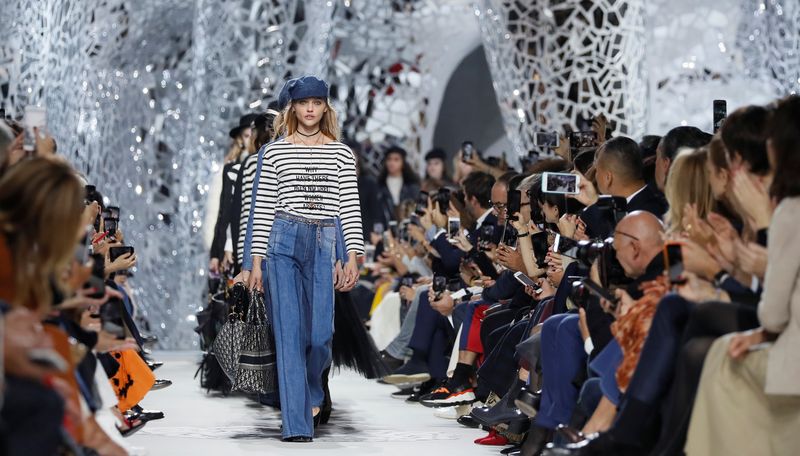 A model presents a creation by Italian designer Maria Grazia Chiuri as part of her Spring/Summer 2018 women’s ready-to-wear collection show for fashion house Dior during Paris Fashion Week
