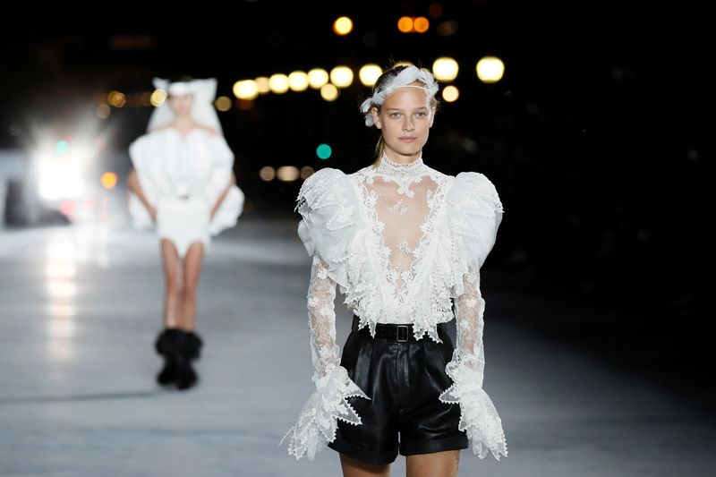Models present creations by designer Anthony Vaccarello as part of his Spring/Summer 2018 women’s ready-to-wear collection show  for fashion house Saint Laurent during Paris Fashion Week