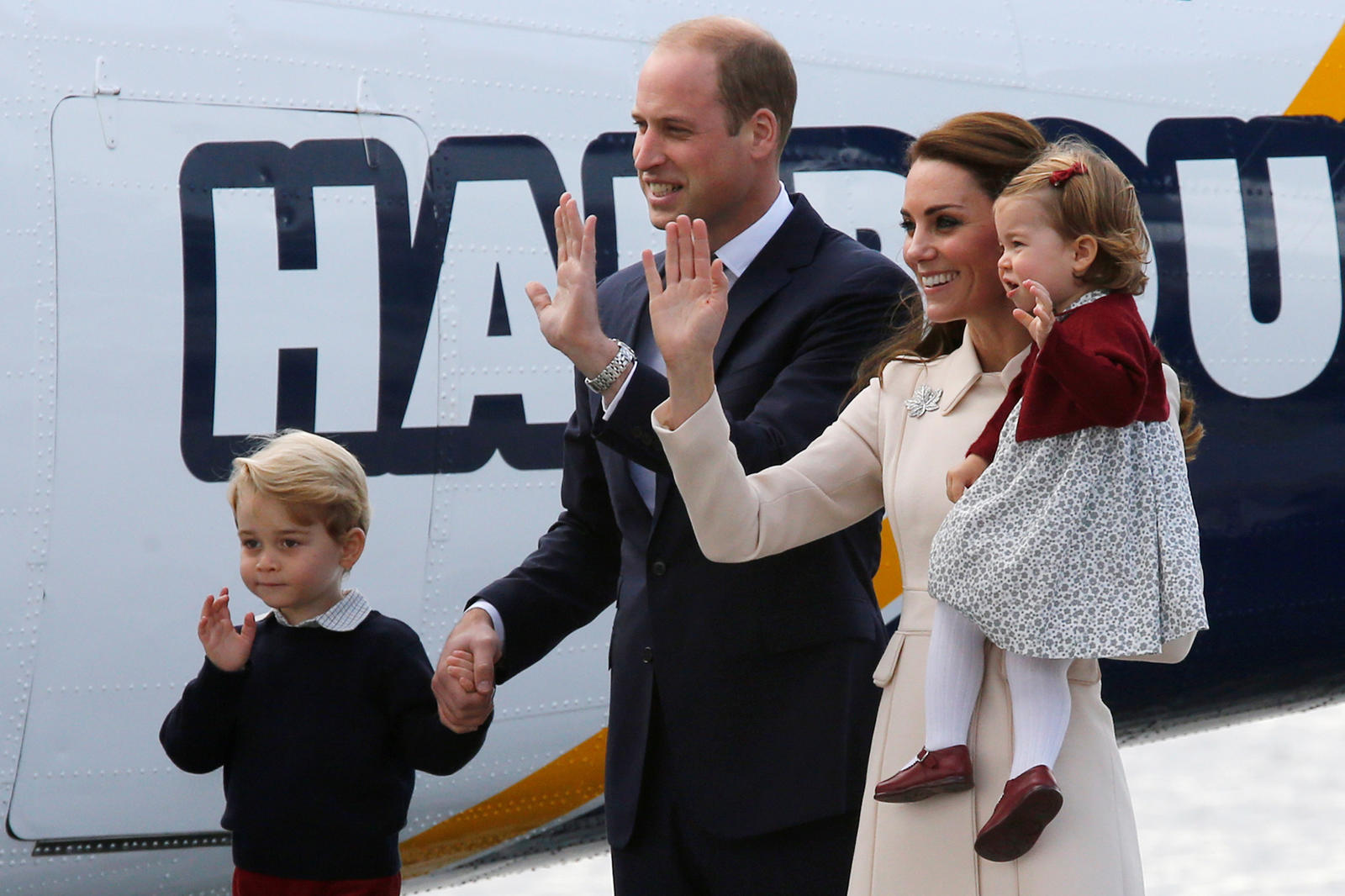 Britain's Prince William, Kate, Duchess of Cambridge, Prince George and Princess Charlotte board a floatplane for their official departure from Canada in Victoria