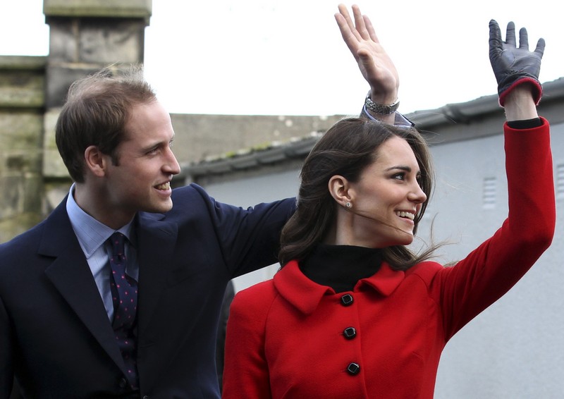 Britain’s Prince William and his fiancee Kate Middleton wave during a visit to St. Andrews University in Fife, Scotland