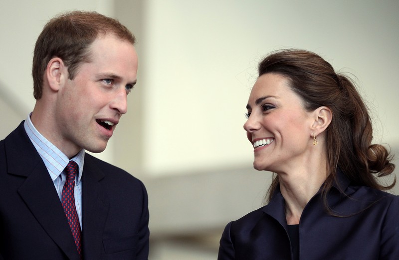 Britain’s Prince William speaks, watched by his fiancee Kate Middleton at the Darwen Aldridge Community Academy, in Darwen, northern England