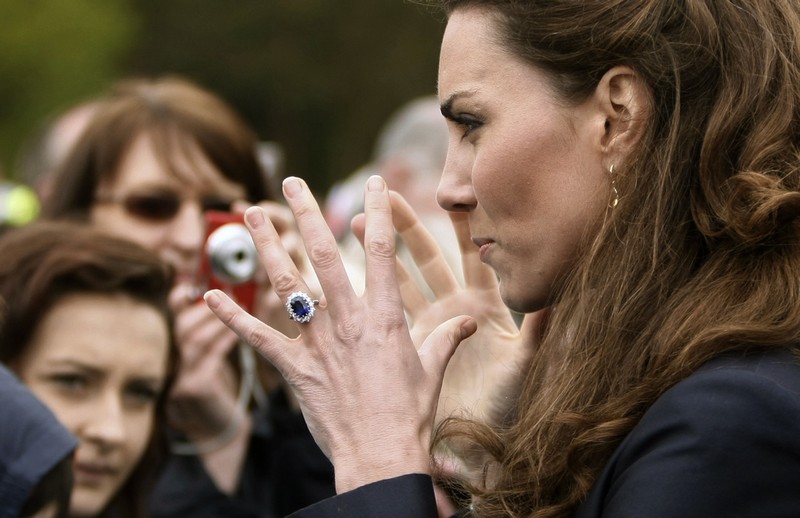 The fiancee of Britain’s Prince William, Kate Middleton, speaks with well-wishers during their visit to Witton Country Park in Darwen, northern England