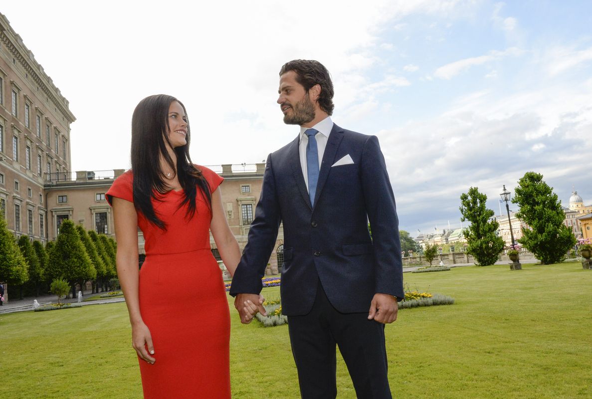 Sweden’s Prince Carl Philip and Hellqvist look at each other during their news conference where they announced their engagement at Stockholm Palace
