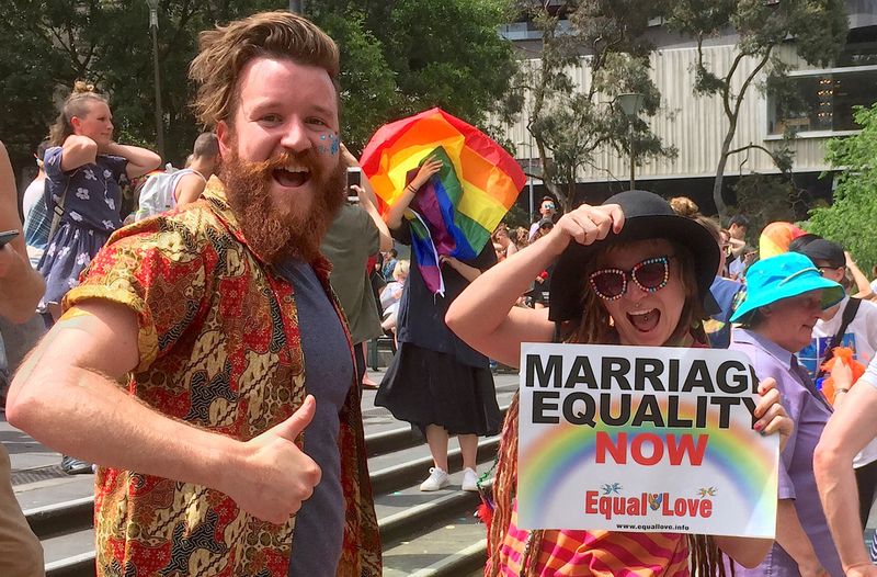 Supporters of the ‘Yes’ vote react as they celebrate after it was announced the majority of Australians support same-sex marriage in a national survey, at a rally in Sydney