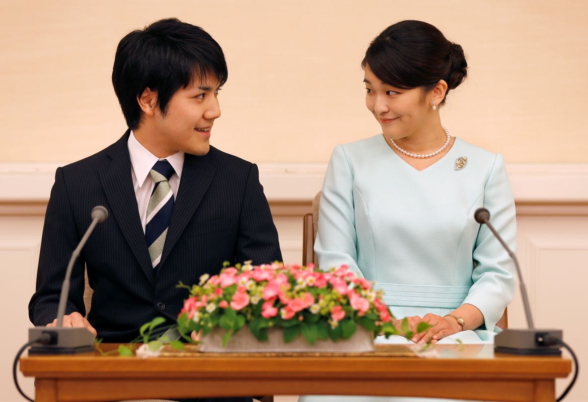 Princess Mako, the elder daughter of Prince Akishino and Princess Kiko, and her fiancee Kei Komuro, a university friend of Princess Mako, smile during a press conference to announce their engagement at Akasaka East Residence in Tokyo