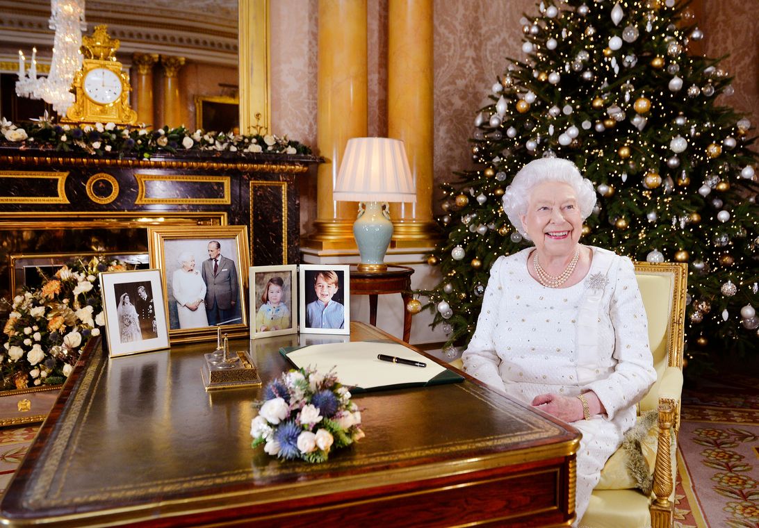 Britain’s Queen Elizabeth is seen sitting at a desk in the 1844 Room after recording her Christmas Day broadcast to the Commonwealth, in Buckingham Palace, in this undated photograph received in London