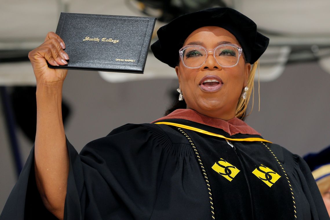 Entertainer Oprah Winfrey holds up her honorary Doctor of Fine Arts degree during Commencement ceremonies at Smith College in Northampton