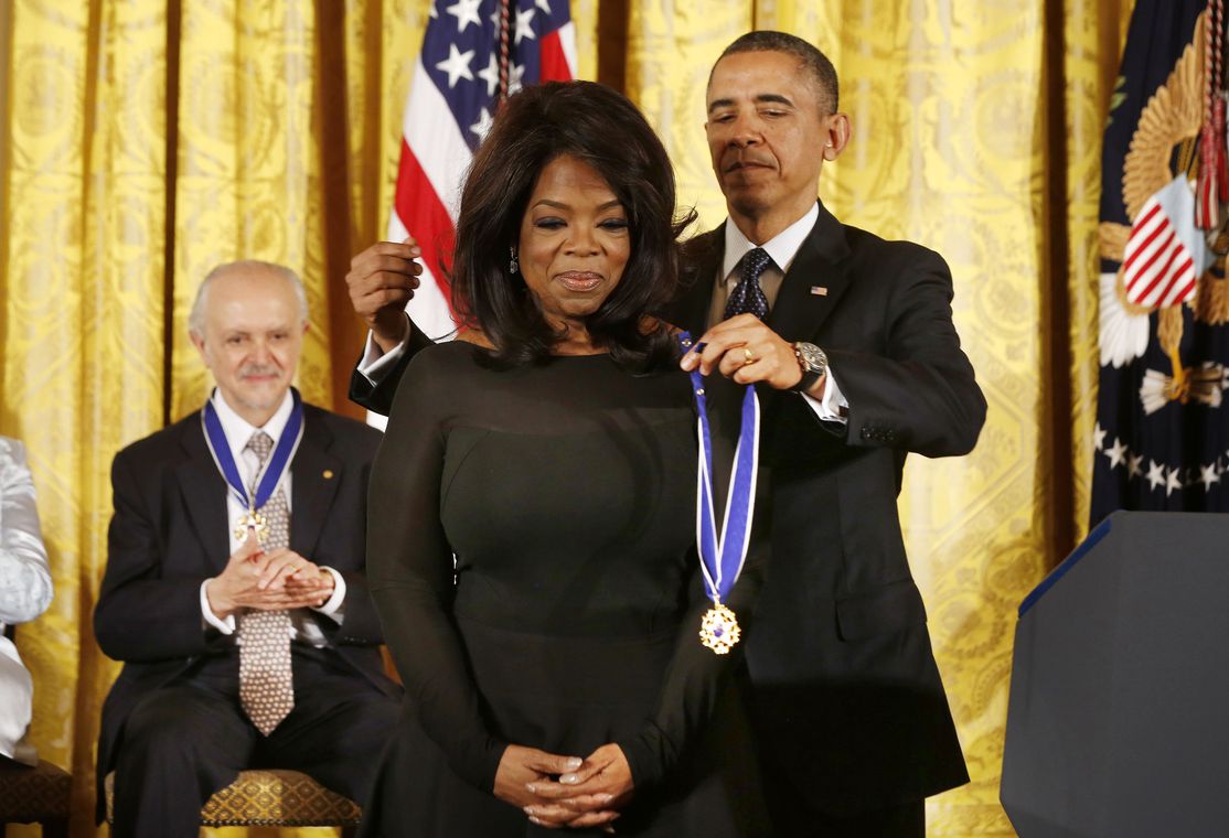 U.S. President Barack Obama presents the Presidential Medal of Freedom to entertainer Oprah Winfrey at a ceremony in the East Room of the White House in Washington