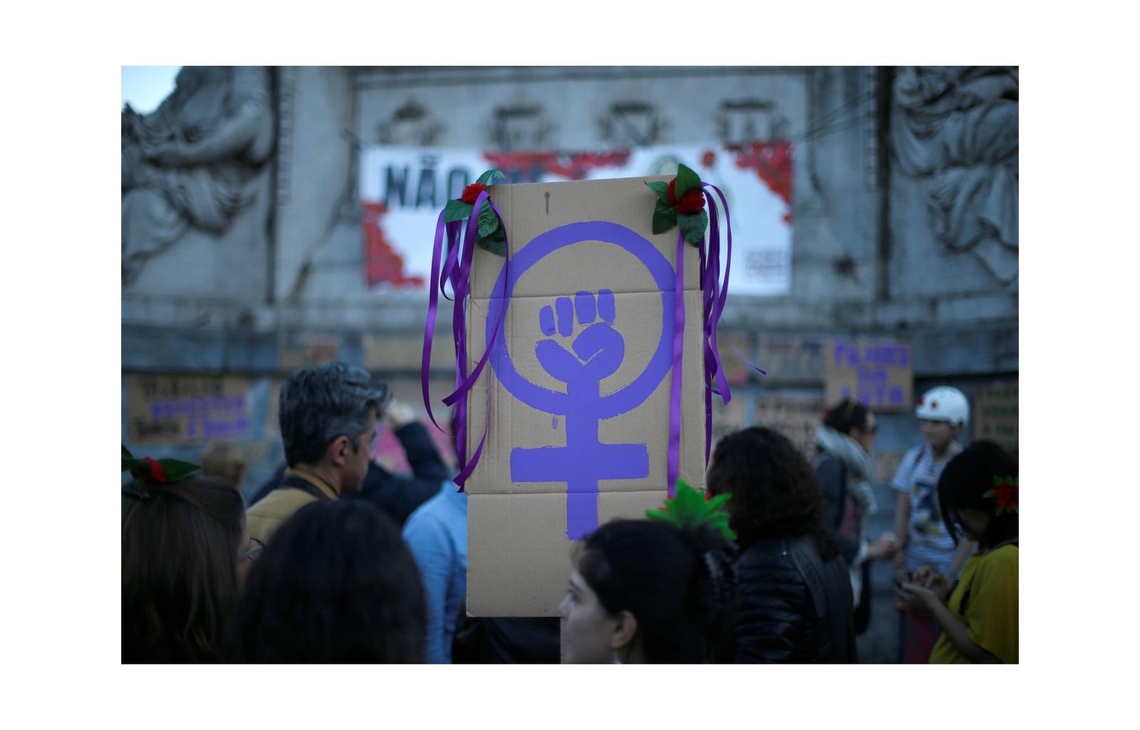 Women attend a meeting to mark International Women’s Day in downtown Lisbon