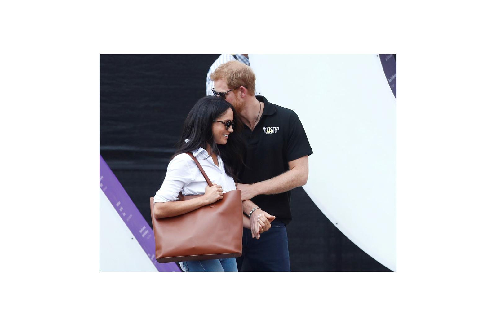 Britain’s Prince Harry arrives with girlfriend actress Markle at the wheelchair tennis event during the Invictus Games in Toronto