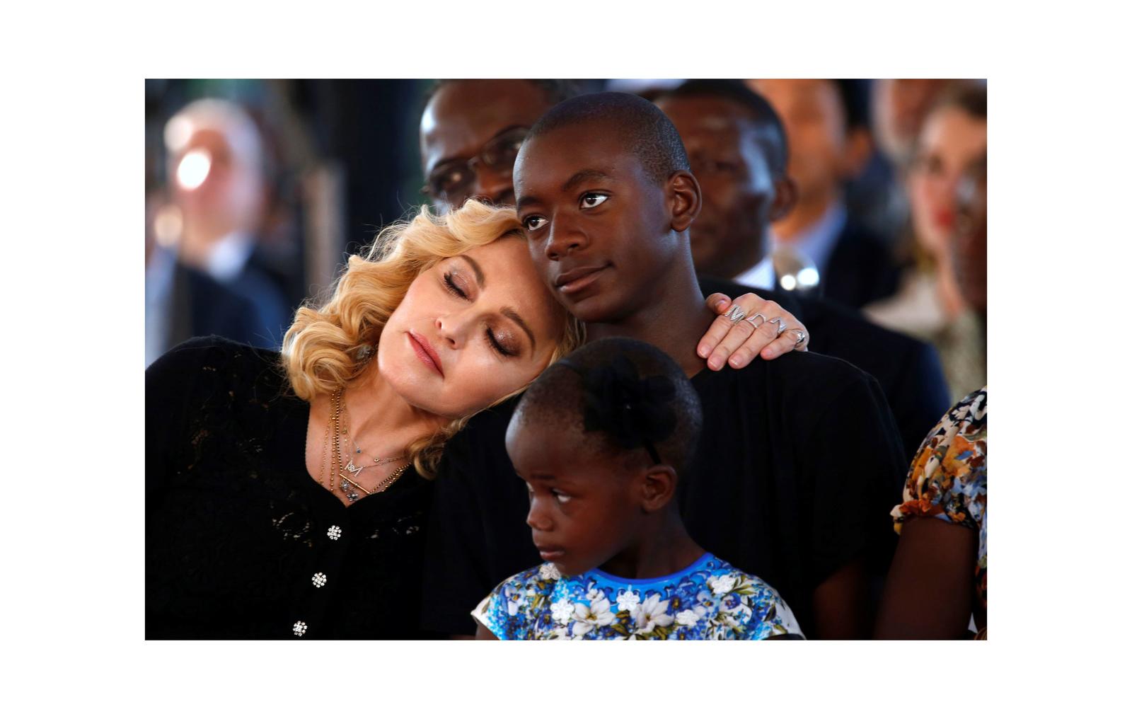 US singer Madonna embraces her son, David Banda ahead of the opening of the Mercy James hospital in Blantyre