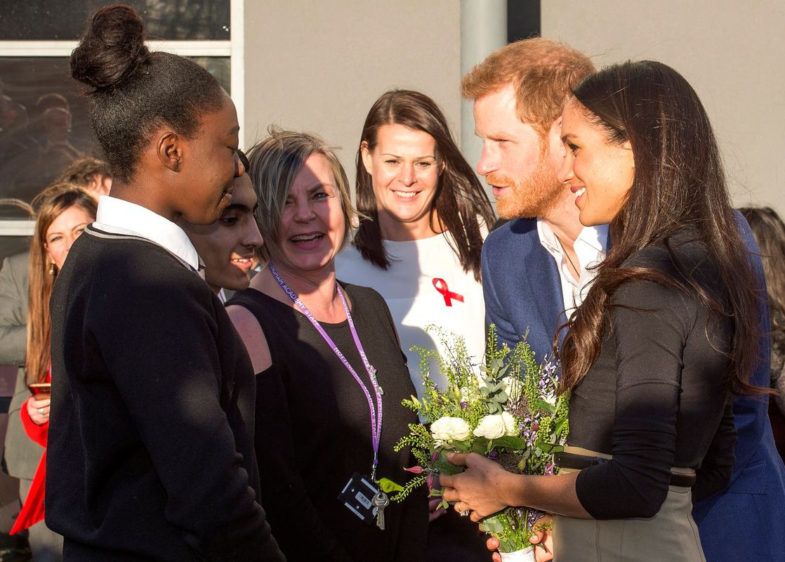 Britain’s Prince Harry and his fiancee Meghan Markle visit the Nottingham Academy school in Nottingham