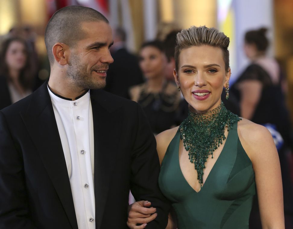 Actress Scarlett Johansson and husband Romain Dauriac arrive at the 87th Academy Awards in Hollywood