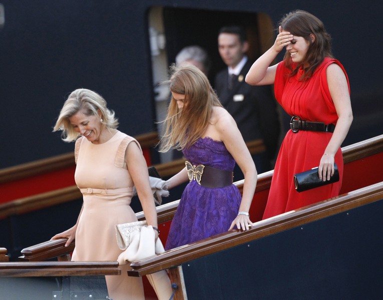 Britain’s Sophie, Countess of Wessex, Princess Beatrice and Princess Eugenie laugh as they leave a drinks reception on the royal yacht Brittania in Edinburgh