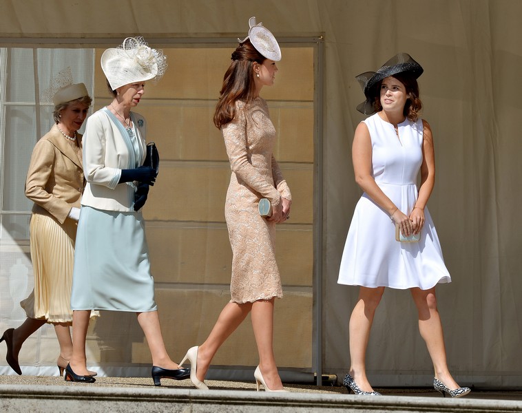 Britain’s Duchess of Gloucester, Princess Anne, Catherine, Duchess of Cambridge  and Princess Eugenie walk together during a garden party held at Buckingham Palace, in central London