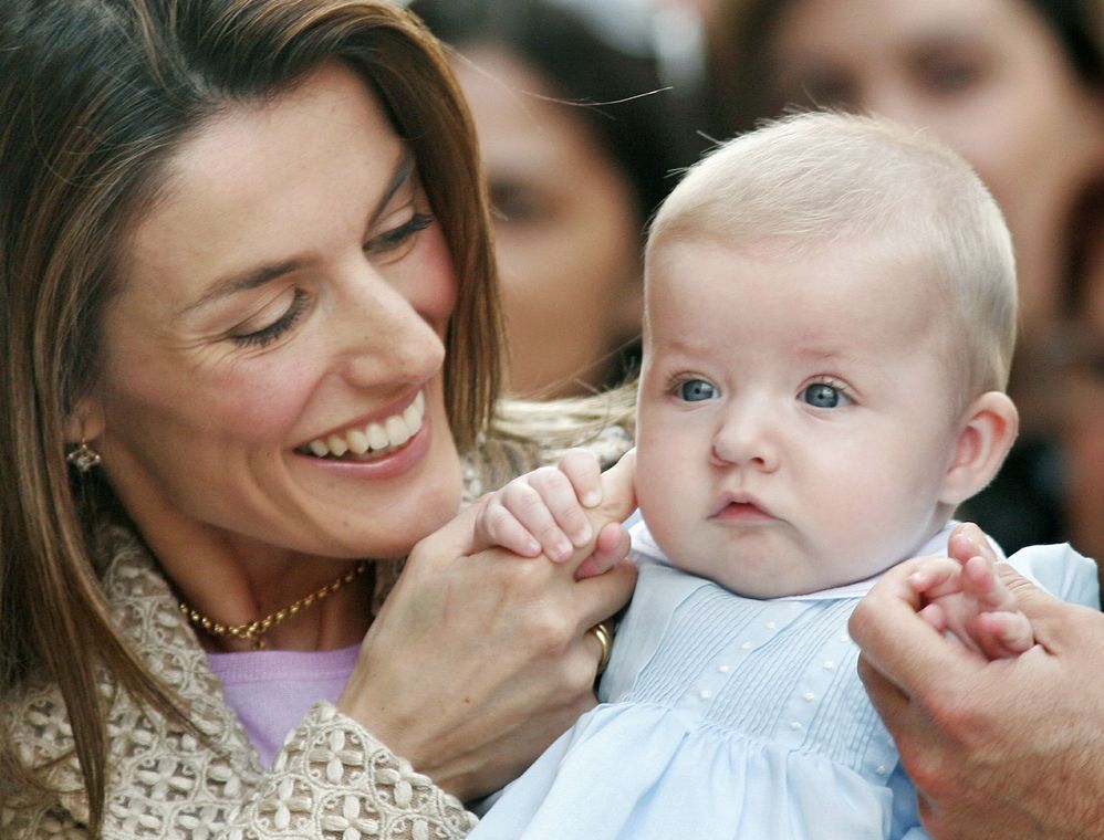 Spanish Princess Letizia holds her daughter Leonor after arriving for Easter Sunday mass at Palma de..