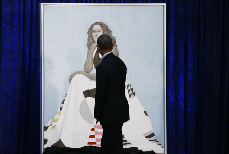 Former U.S. President Obama walks past Michelle Obama portrait during unveiling at the Smithsonians National Portrait Gallery in Washington