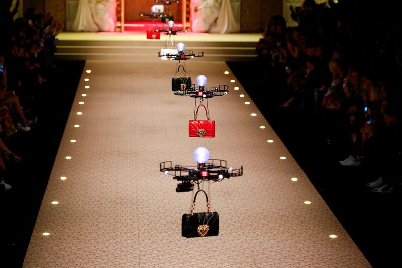 Drones carry bags, the creations from the Dolce & Gabbana Autumn/Winter 2018 women’s collection during Milan Fashion Week in Milan