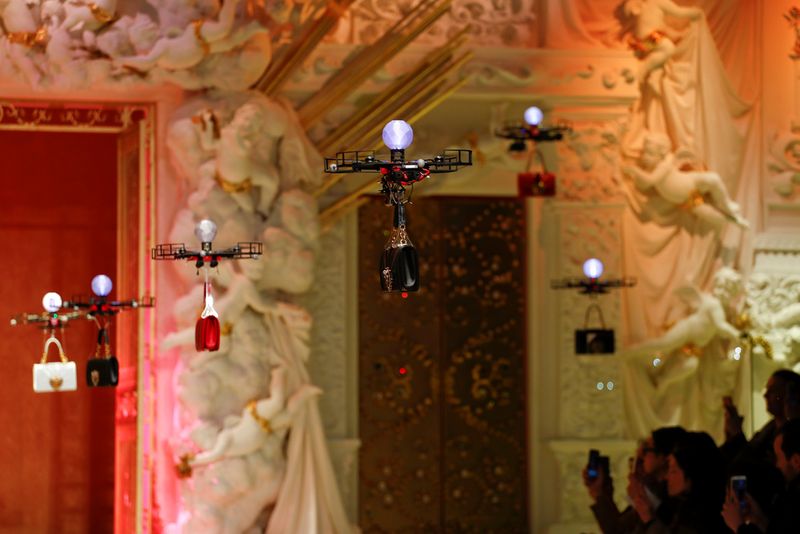 Drones carry bags, the creations from the Dolce & Gabbana Autumn/Winter 2018 women’s collection during Milan Fashion Week in Milan