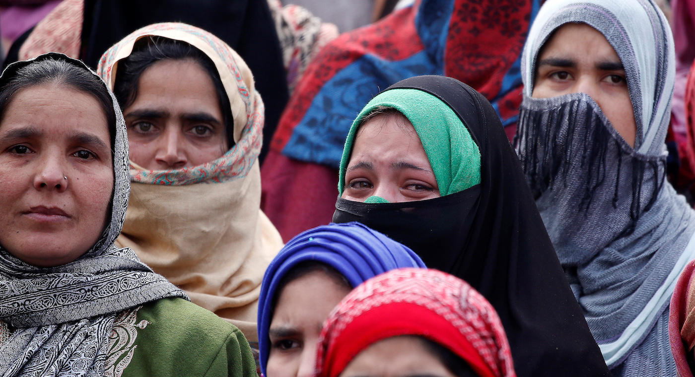 Women mourn during the funeral of Fardeen Ahmad Khandey, a suspected militant who according to local media was killed in a gunbattle with Indian security forces after an attack on a police training center on Sunday, in Tral