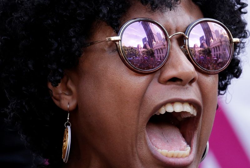 A demonstrator reacts during the wake of Rio de Janeiro’s city councillor Marielle Franco, 38, and her driver Anderson Gomes who were shot dead, outside the city council chamber in Rio de Janeiro