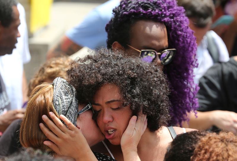Demonstrators react before the wake of councilwoman Marielle Franco, 38, who was shot dead, in Rio de Janeiro