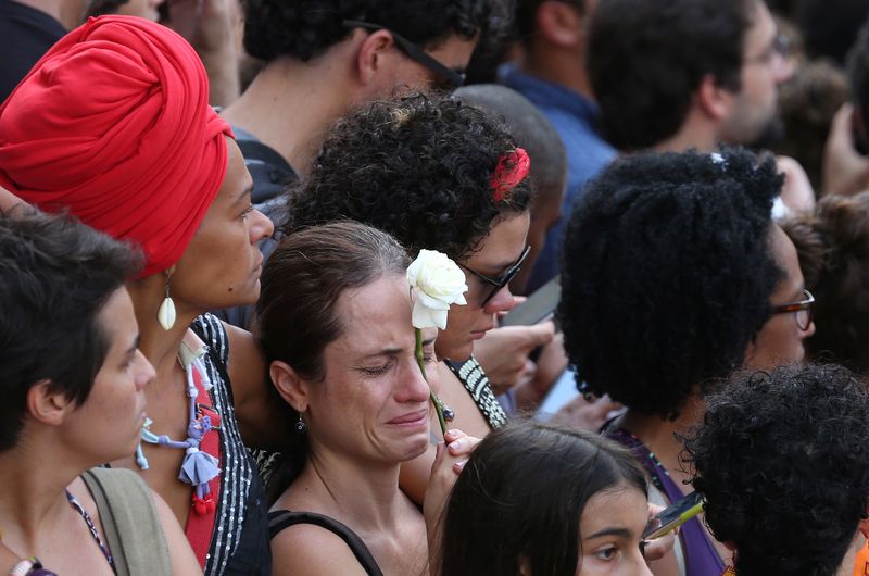 Demonstrators react before the wake of councilwoman Marielle Franco, 38, who was shot dead, in Rio de Janeiro
