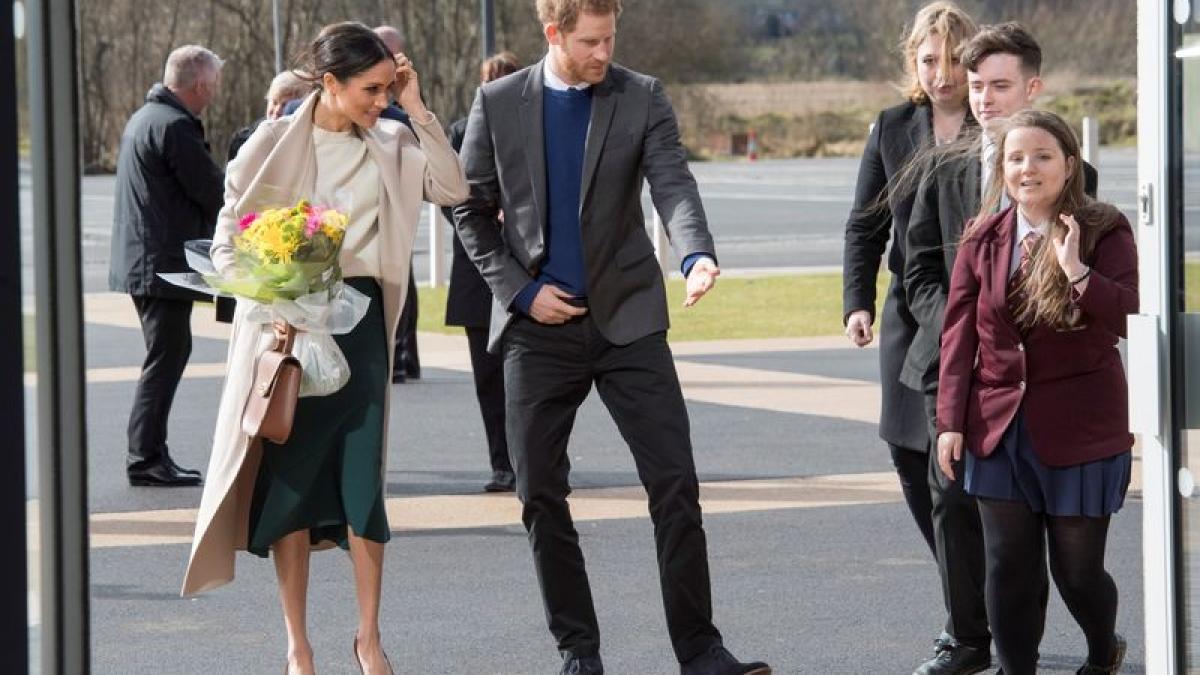 Britain’s Prince Harry and his fiancee Meghan Markle arrive for a visit to the Eikon Exhibition Centre in Lisburn