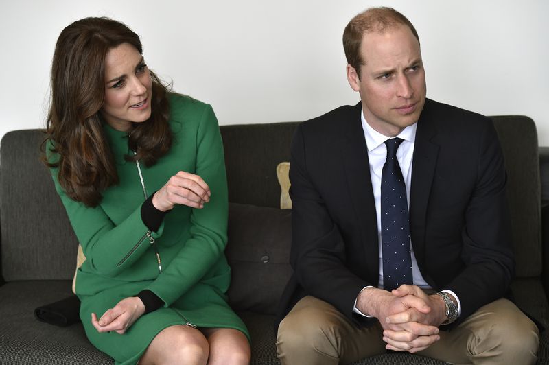 Britain’s Prince William and his wife Catherine, Duchess of Cambridge, speak with a former patient during their visit to St Thomas’ Hospital in London