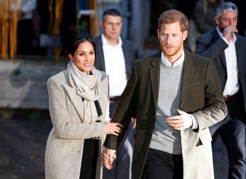 Britain’s Prince Harry and his fiancee Meghan Markle leave after visiting radio station Reprezent FM, in Brixton, London