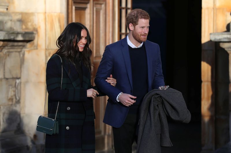Britain’s Prince Harry and his fiancee Meghan Markle attend a reception for young people at the Palace of Holyroodhouse in Edinburgh