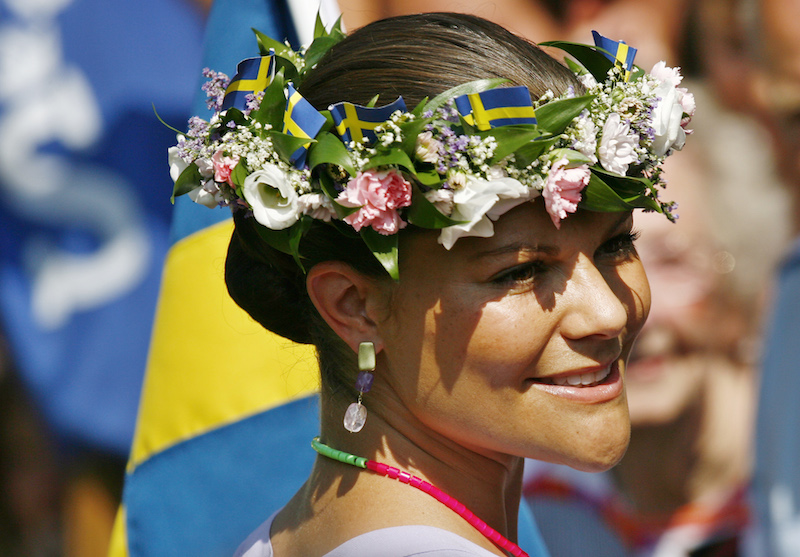 Sweden’s Crown Princess Victoria wears a floral wreath given to her by a well-wisher during her 32nd birthday celebration in Borgholm