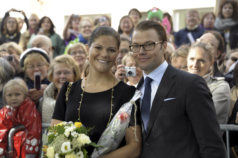 Crown Princess Victoria and Prince Daniel of Sweden meet people at a local market place in Turku
