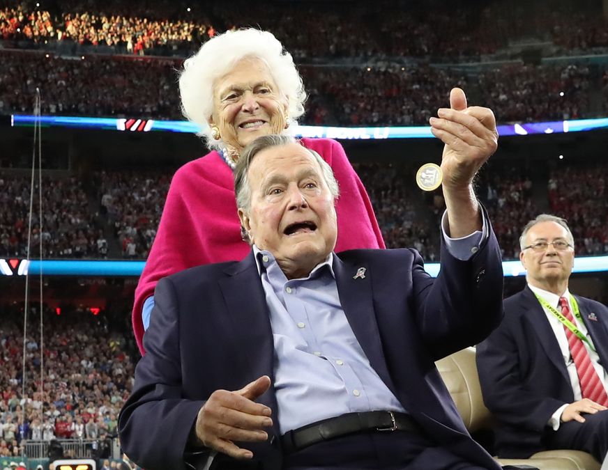 Former U.S. President George H.W. Bush and former first lady Barbara Bush on the field ahead of the start of Super Bowl LI between the New England Patriots and the Atlanta Falcons in Houston