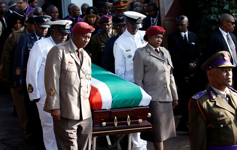 The coffin of Winnie Madikizela-Mandela is carried from her home during her funeral in Soweto