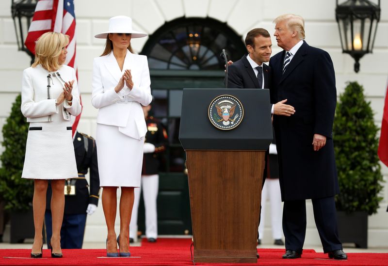 U.S. President Donald Trump and French President Emmanuel Macron take part in a State Arrival on the South Lawn of the White House in Washington
