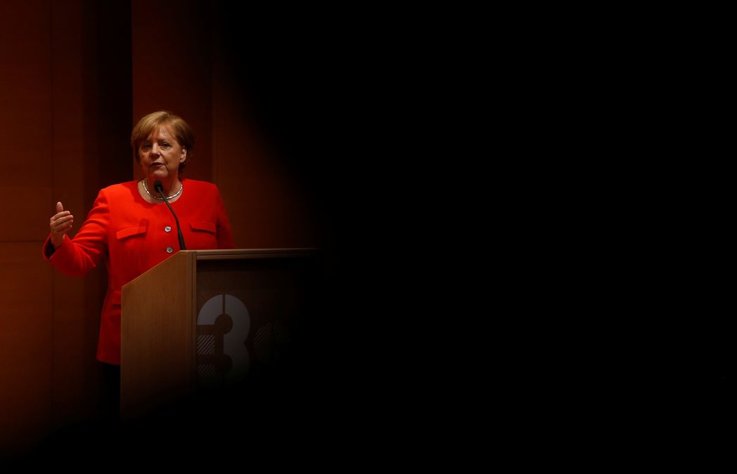 German Chancellor Angela Merkel delivers a speech during her visit to the Institute of Research and Innovation in Health in Porto