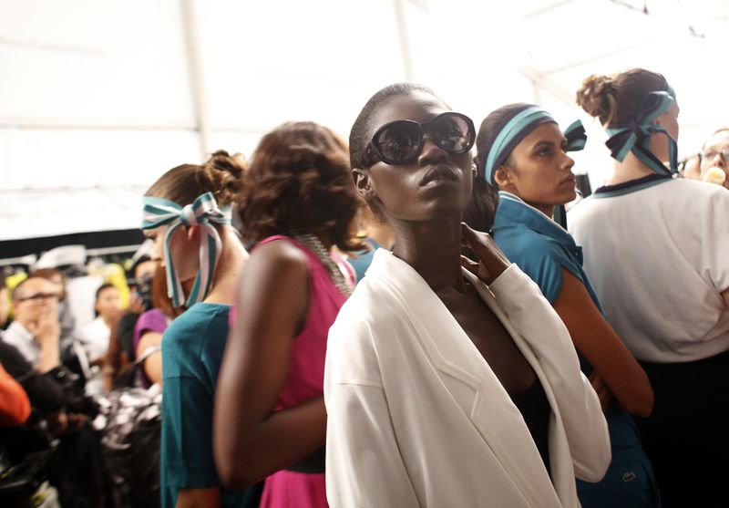 Models wait backstage before the Lacoste Spring 2010 collection during New York Fashion Week