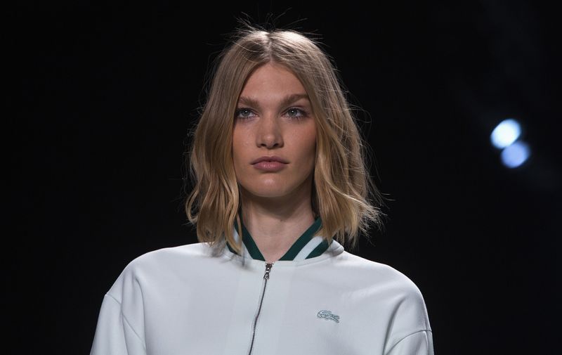 A model presents a creation from the Lacoste Spring/Summer 2014 collection during New York Fashion Week