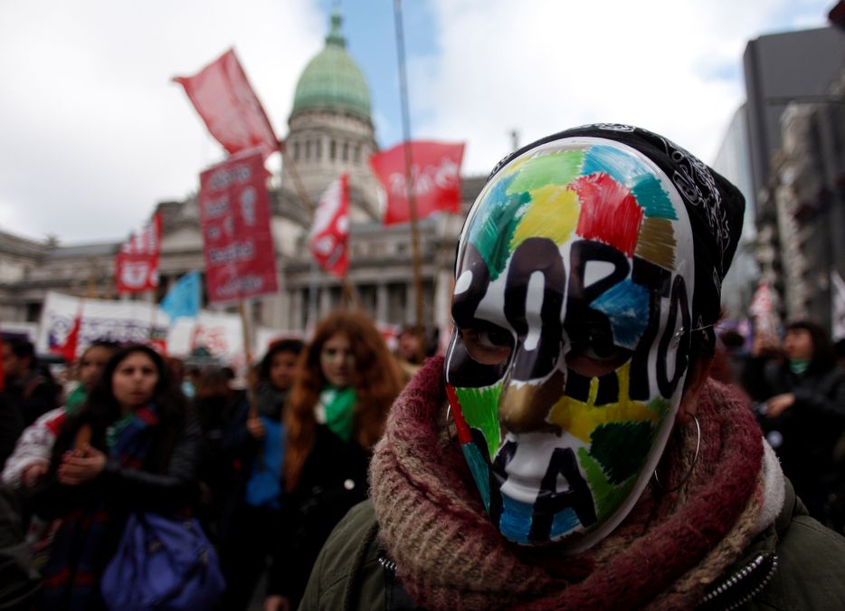A demonstrator attends a protest in favour of legalising abortion outside the Congress while lawmakers debate an abortion bill in Buenos Aires