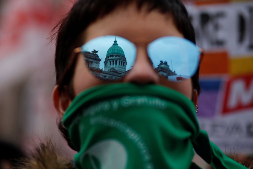 A demonstrator attends a protest in favour of legalising abortion outside the Congress while lawmakers debate an abortion bill in Buenos Aires