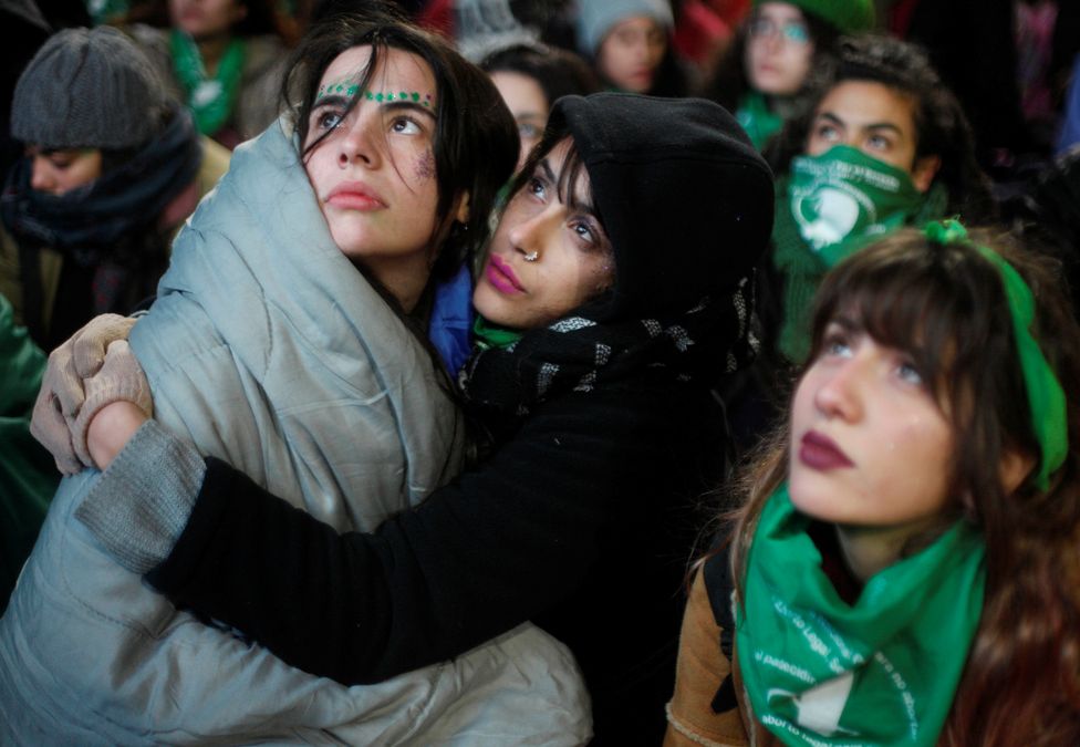 Demonstrators attend a protest in favour of legalising abortion outside the Congress while lawmakers debate an abortion bill in Buenos Aires