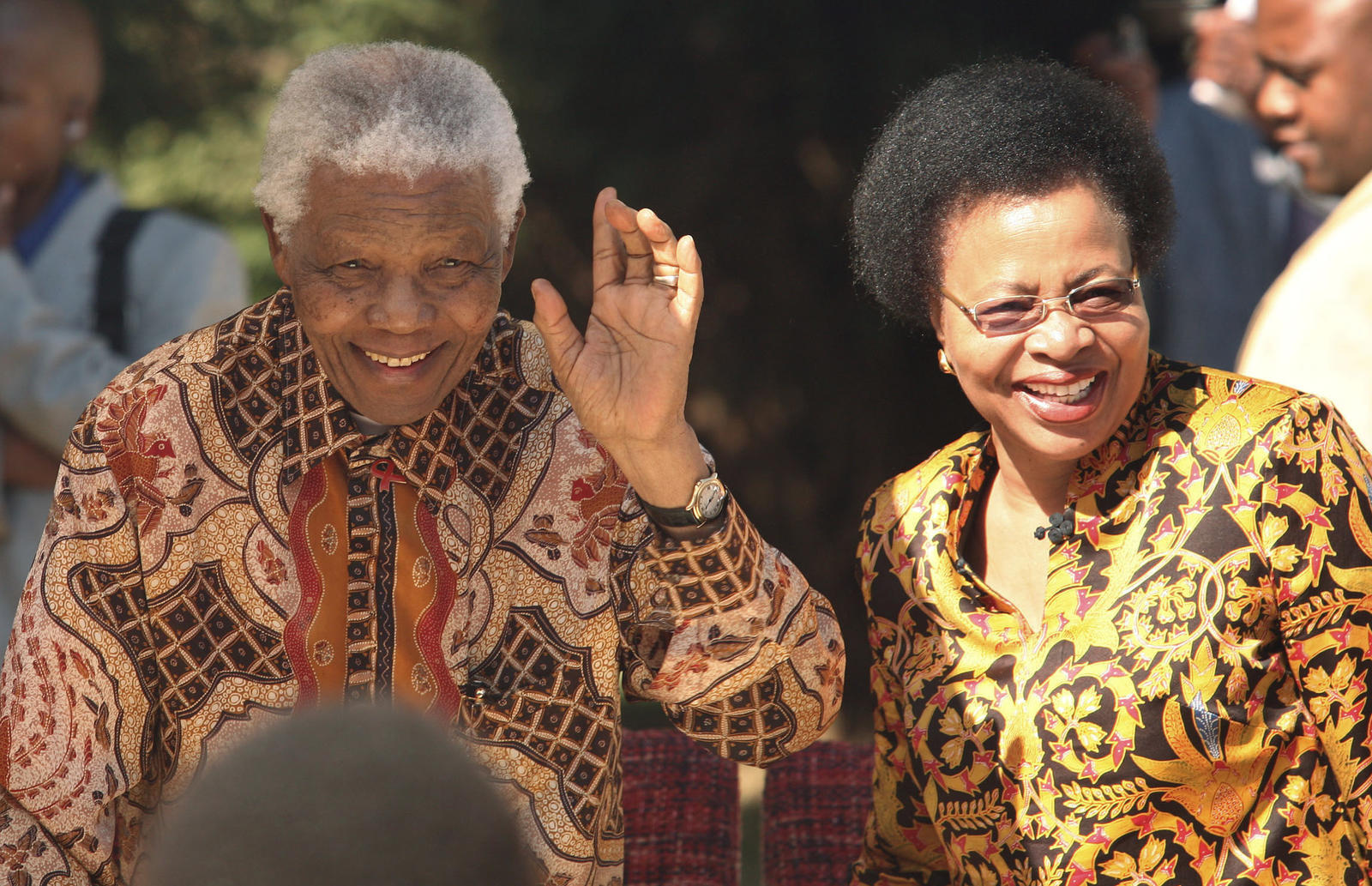 Former president of South Africa,Nelson Mandela smiles as he arrives with his wife Graca Machel for his 89th birthday celebrations which he decided to celebrate with children in Johannesburg