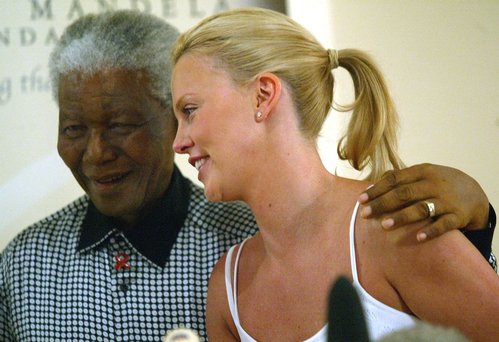 SOUTH AFRICAN ACTRESS THERON MEETS FORMER PRESIDENT MANDELA AT HIS FOUNDATION IN JOHANNESBURG.