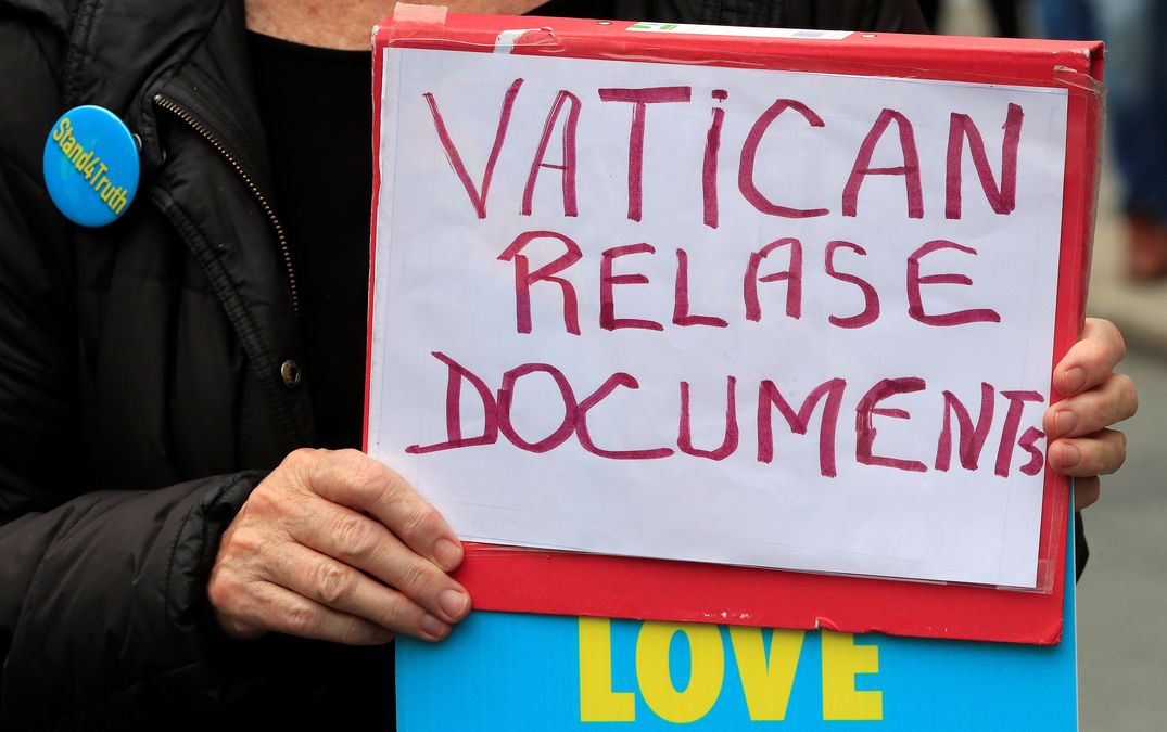 A person takes part in a protest during the visit of Pope Francis to Dublin